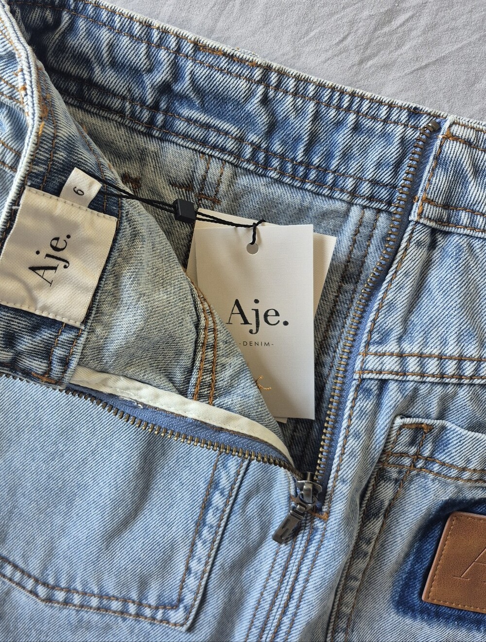 Aje Elena Denim Mini Skirt NWT Light/Mid Wash 6